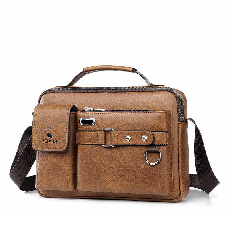 Borsa a tracolla in pelle marrone con manico, tasche multiple e chiusura a zip. Design elegante e funzionale, ideale per lavoro e viaggio.