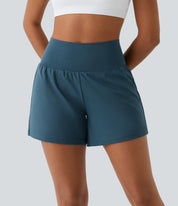 Shorts sportivi da donna blu, vita alta, tessuto elasticizzato, ideali per yoga e fitness. Design moderno e confortevole.