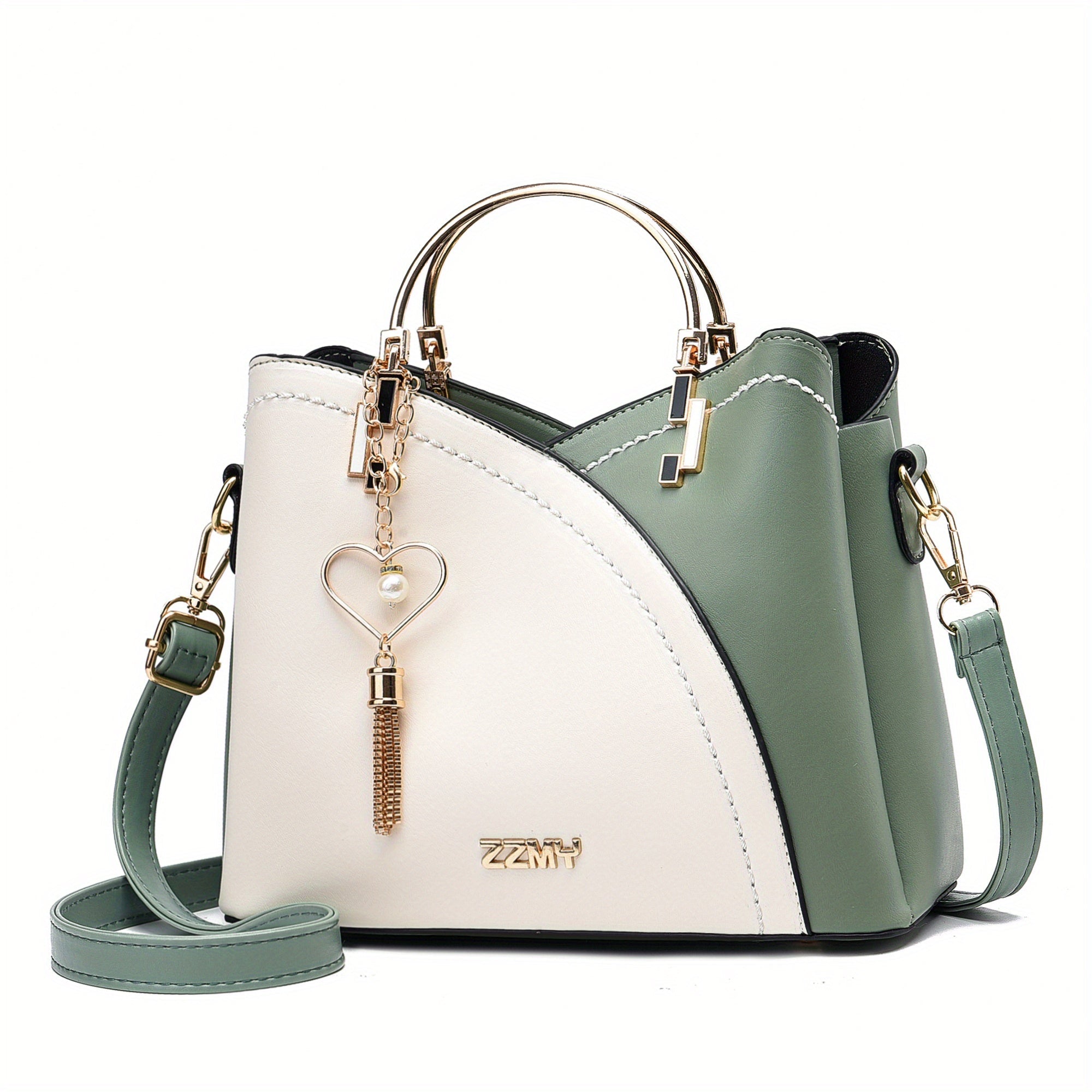 Borsa a mano donna in pelle bicolore verde e bianco, con tracolla regolabile, manico dorato e ciondolo a cuore. Elegante e moderna.