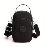 Borsa a tracolla nera in nylon, compatta e resistente, con tasche multiple e cinturino regolabile. Ideale per viaggi e uso quotidiano.