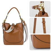 Borsa a secchiello in pelle marrone con dettagli in metallo dorato, tracolla regolabile e cuciture a contrasto. Design elegante e moderno.
