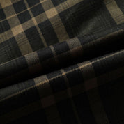 Tessuto scozzese nero e beige, motivo a quadri, ideale per abbigliamento moda, sartoria, alta qualità, stile classico ed elegante.