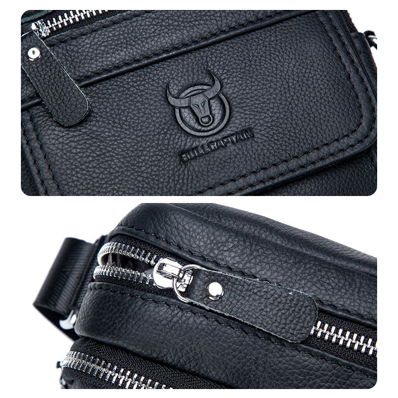 Borsa a tracolla in pelle nera con logo toro, doppia cerniera argentata, design elegante e resistente. Accessorio moda uomo, alta qualità.