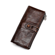 Portafoglio in pelle marrone scuro con chiusura a bottone e cerniera, design elegante e spazioso, accessorio moda uomo e donna.
