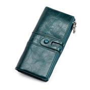 Portafoglio donna in pelle verde, design elegante con chiusura a bottone e cerniera, accessorio moda, ideale per carte e contanti.