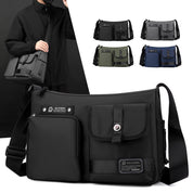 Borsa a tracolla nera unisex, design moderno con tasche multiple, disponibile in vari colori. Ideale per lavoro e viaggio. Accessorio moda pratico.