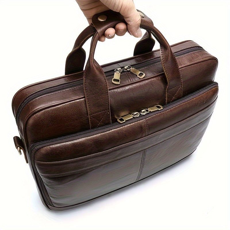 Borsa ventiquattrore in pelle marrone con doppia cerniera, manici robusti e design elegante. Ideale per lavoro e viaggi d'affari.