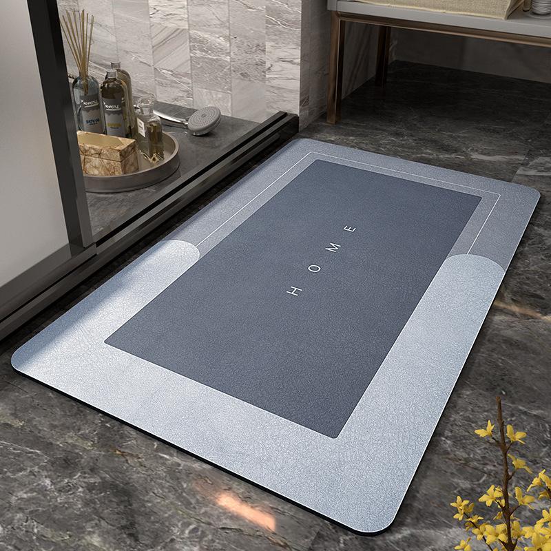 Tappeto moderno grigio per ingresso, design rettangolare con scritta "HOME", pavimento in marmo, decorazione elegante per interni.