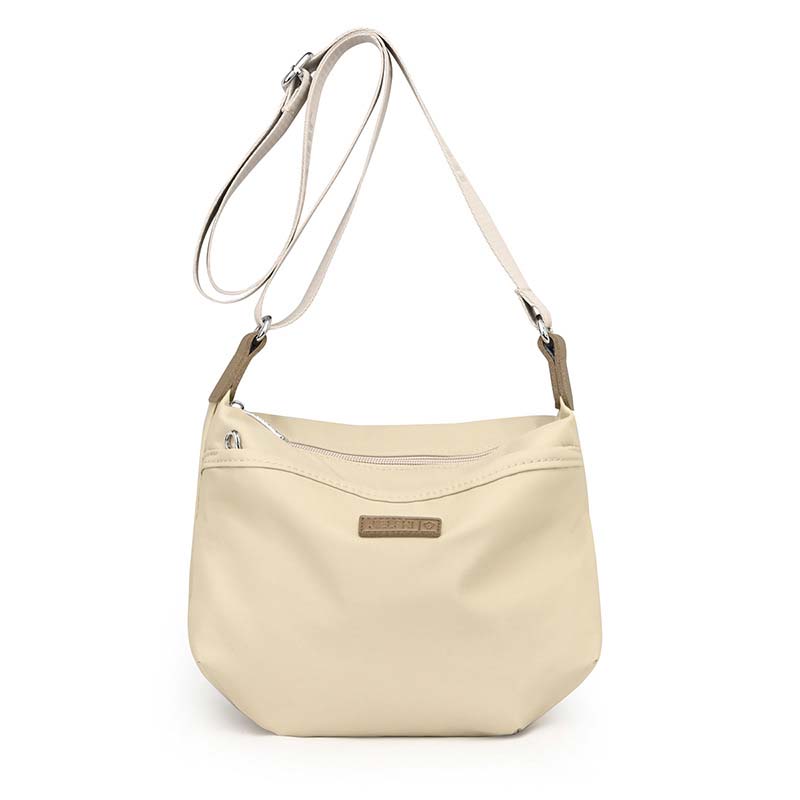 Borsa a tracolla beige in pelle sintetica, design elegante e minimalista, con cerniera superiore e cinturino regolabile. Accessorio moda donna.