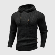 Felpa nera con cappuccio, design intrecciato, maniche lunghe, cordini regolabili, stile casual, tessuto morbido, ideale per moda autunno-inverno.