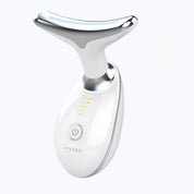 Dispositivo massaggiatore viso a LED, bianco, con design ergonomico a forma di T, tecnologia anti-età, pulsante di accensione, ideale per cura della pelle.