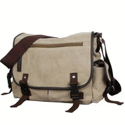 Borsa a tracolla in tela beige con dettagli in pelle marrone, tasca frontale con zip, fibbie regolabili. Ideale per lavoro e viaggio.