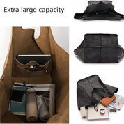 Borsa in pelle nera con grande capacità, tasche interne, adatta per laptop e accessori. Ideale per lavoro e viaggio. Design elegante e funzionale.