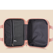 Valigia rigida rosa aperta, con scomparti interni in rete nera, ideale per viaggi. Design compatto, resistente e leggero.