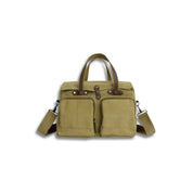 Borsa a tracolla in tela beige con manici in pelle marrone, tasche frontali con zip, ideale per lavoro e viaggio. Accessorio moda unisex.