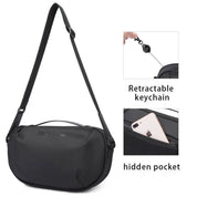 Borsa a tracolla nera con portachiavi retrattile e tasca nascosta, design moderno e funzionale, ideale per viaggi e uso quotidiano.
