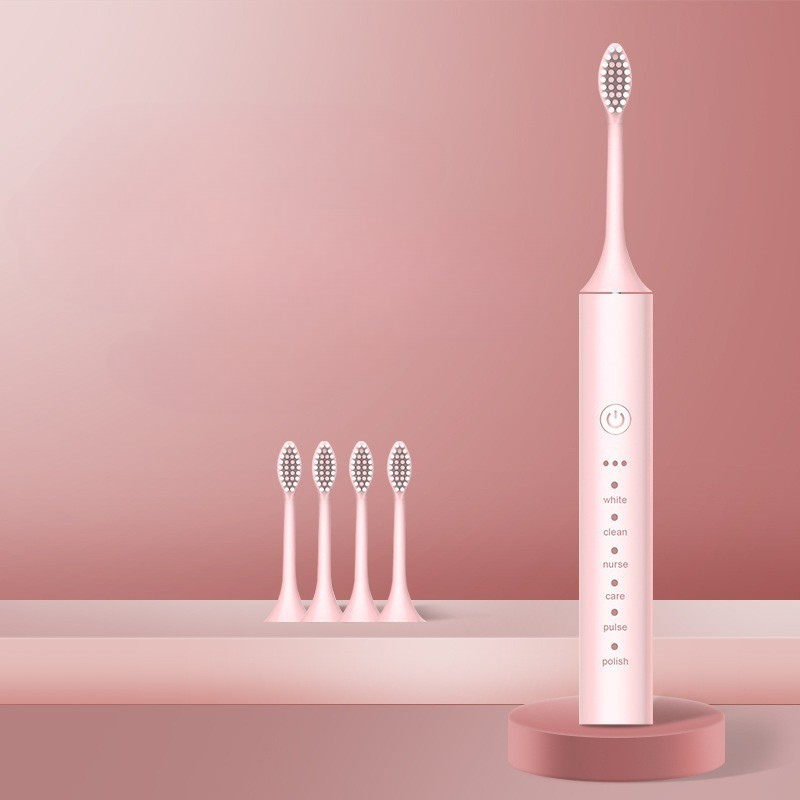 Spazzolino elettrico rosa con testine di ricambio, design moderno, funzioni multiple per sbiancamento e pulizia dentale efficace.