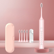 Spazzolino elettrico rosa con testine di ricambio, custodia da viaggio e caricatore. Design elegante, ideale per igiene orale quotidiana.