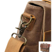 Borsa a tracolla in tela marrone con fibbia in metallo, design vintage, resistente e spaziosa, ideale per lavoro o viaggio.