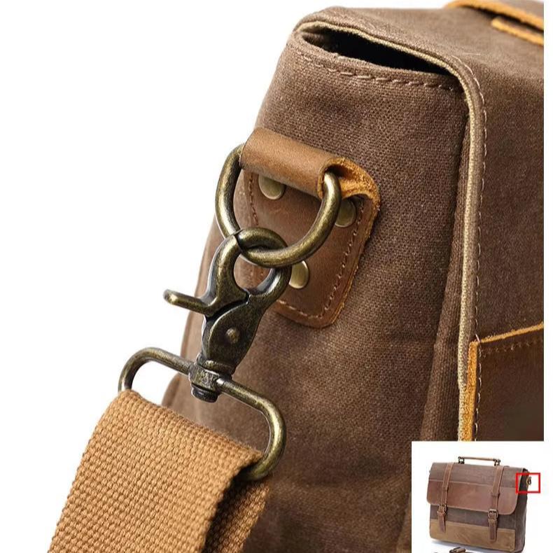 Borsa a tracolla in tela marrone con fibbia in metallo, design vintage, resistente e spaziosa, ideale per lavoro o viaggio.