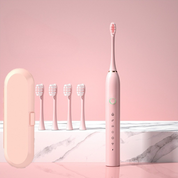 Spazzolino elettrico rosa con cinque testine di ricambio e custodia, design elegante, ideale per igiene orale, cura dentale avanzata.
