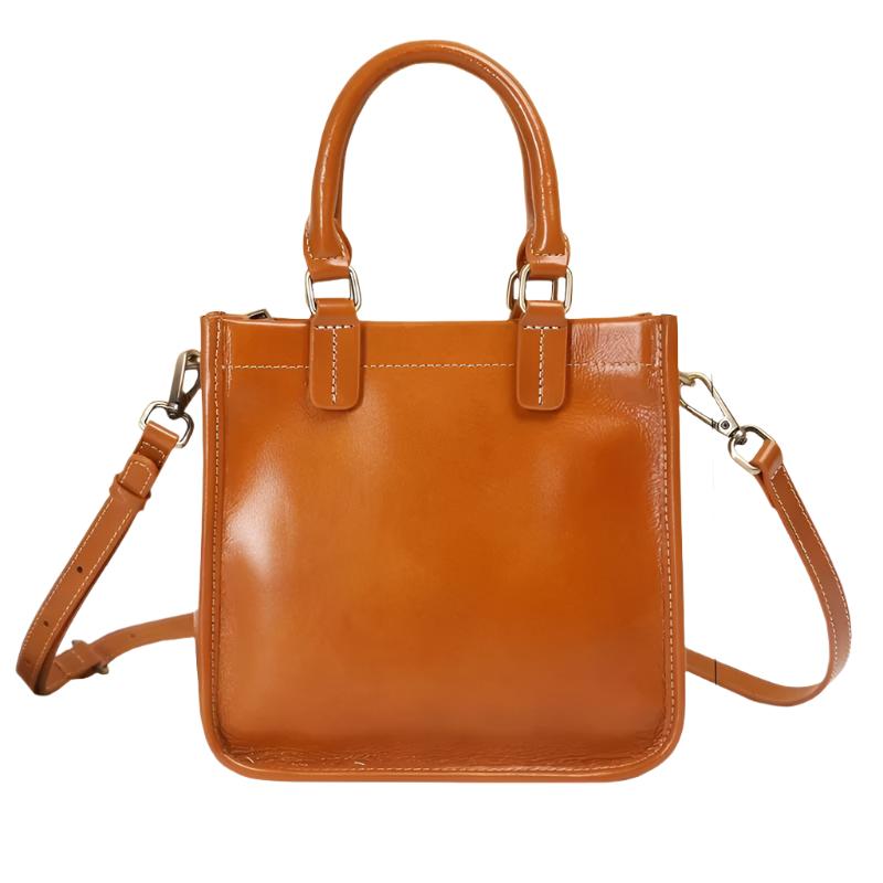 Borsa a mano in pelle marrone, design elegante con tracolla regolabile e manici robusti. Perfetta per moda donna, accessori di lusso.