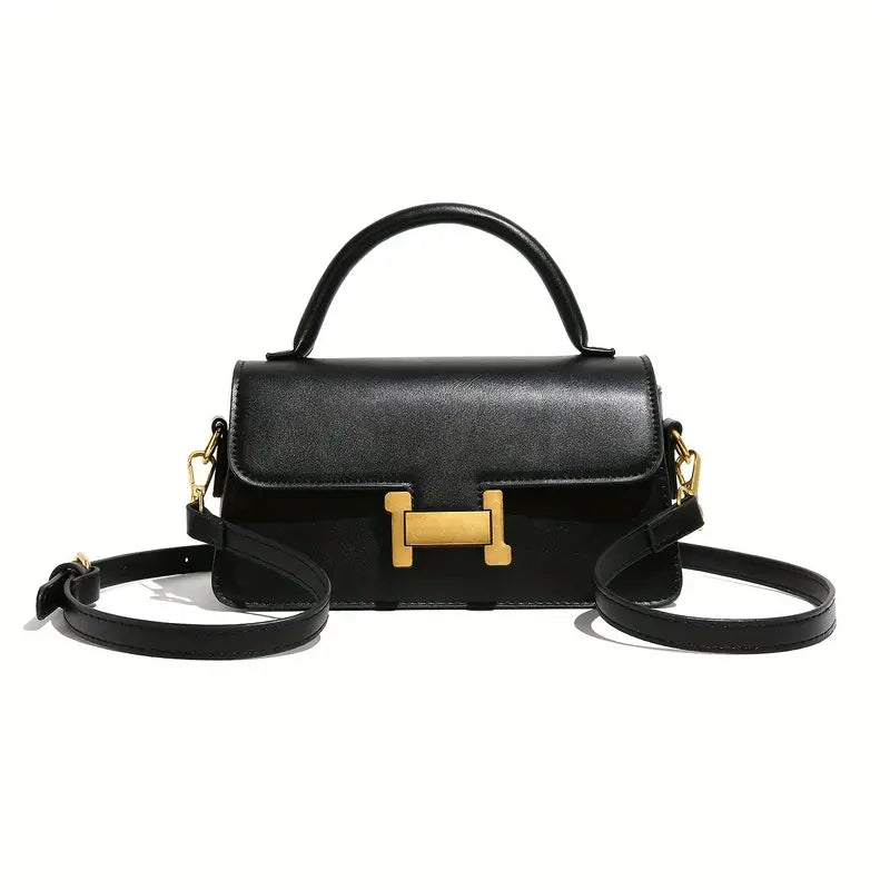 Borsa a tracolla nera in pelle con chiusura dorata a forma di H, manico superiore e tracolla regolabile. Elegante accessorio moda donna.