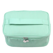 Borsa cosmetica verde menta con cerniera, design a coste, manico superiore, ideale per organizzare trucchi e accessori da viaggio.