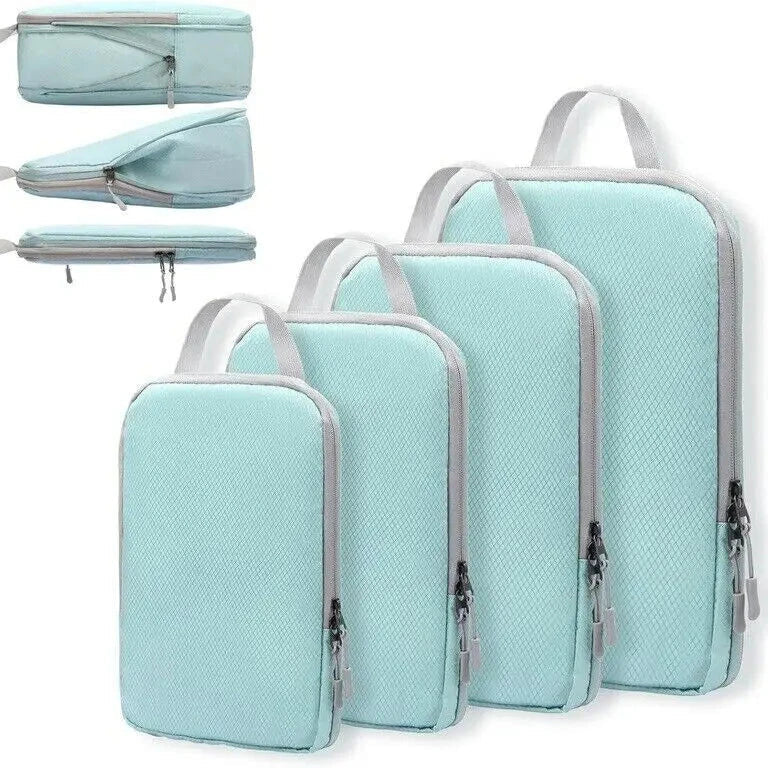 Set di organizer da viaggio in tessuto azzurro, con cerniere e manici, in quattro diverse dimensioni. Ideale per valigie e bagagli.