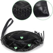 Borsa a mano nera in pelle con dettagli intrecciati, chiusura a zip, scomparti interni numerati, design elegante e moderno.