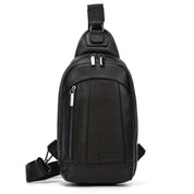 Zaino monospalla in pelle nera, design moderno con cerniere argentate, tasca frontale, ideale per uomo, perfetto per viaggi e uso quotidiano.