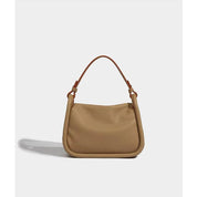 Borsa a spalla in pelle beige, design minimalista, manico marrone, moda donna, accessorio elegante, perfetta per ogni occasione.