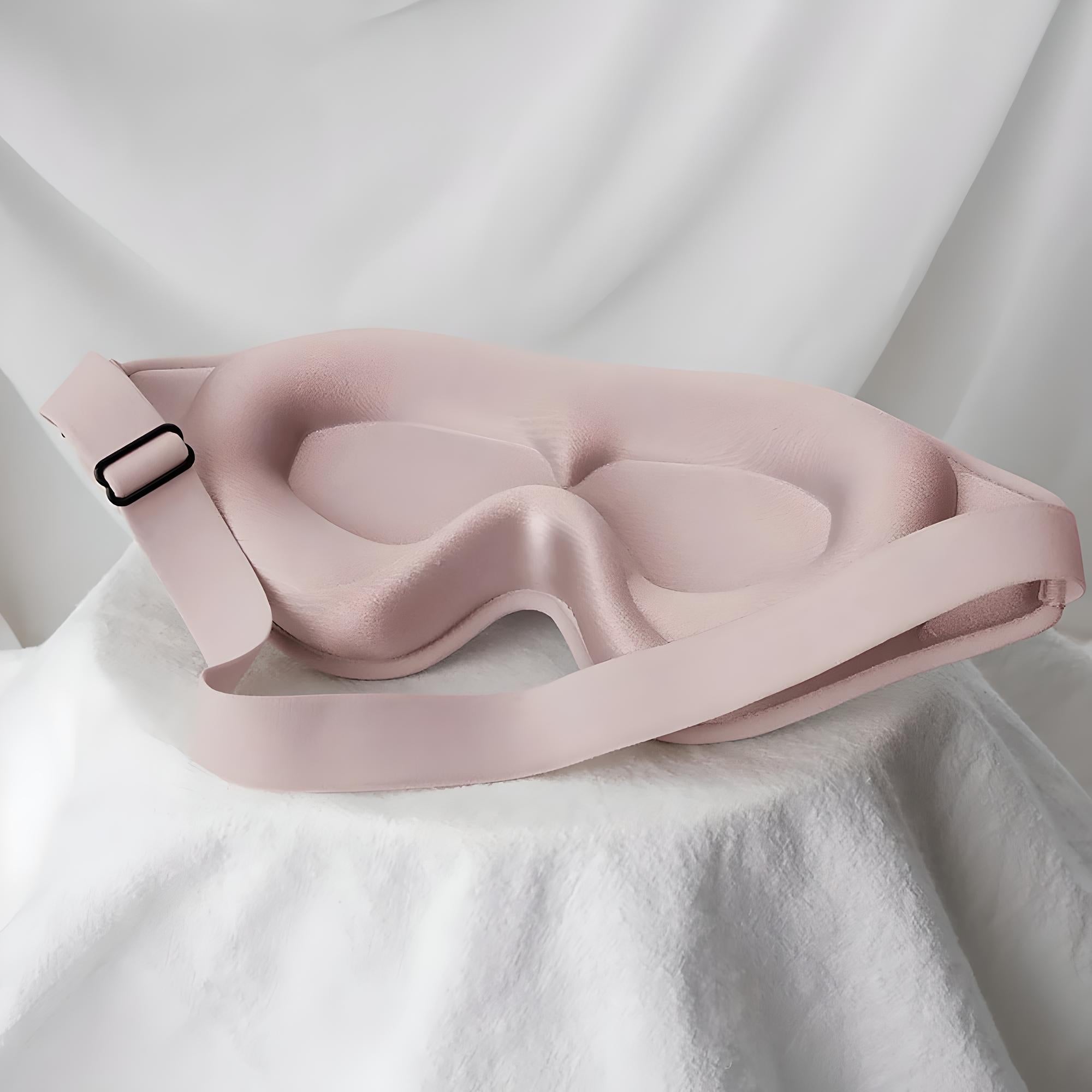 Maschera per dormire rosa in memory foam, design ergonomico, cinturino regolabile, ideale per bloccare la luce e migliorare il sonno.