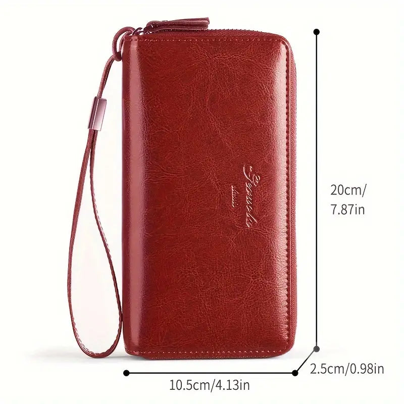 Portafoglio donna in pelle rossa con cerniera, cinturino da polso, dimensioni 20x10.5x2.5 cm. Elegante e pratico accessorio moda.