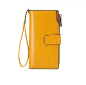 Portafoglio donna in pelle gialla con cinturino da polso, chiusura a scatto e zip. Accessorio moda elegante e funzionale.
