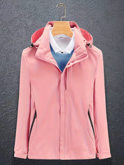 Giacca softshell rosa da donna con cappuccio, chiusura zip, su gruccia. Design elegante, ideale per outdoor e casual. Tessuto impermeabile.