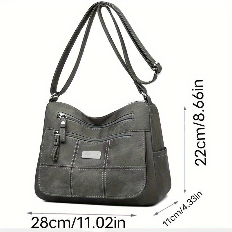 Borsa a tracolla in pelle grigia, dimensioni 28x22x11 cm, con tasche multiple e cerniere, design elegante e pratico per uso quotidiano.