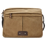 Borsa a tracolla in tela marrone, design vintage, tasche frontali, chiusura con cerniera, ideale per lavoro e viaggio. Accessorio moda unisex.