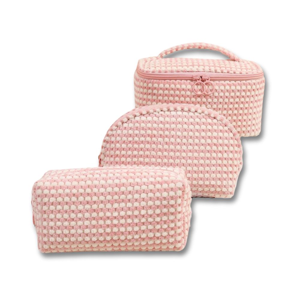 Set di tre beauty case rosa intrecciati, design elegante, ideale per viaggi e organizzazione cosmetici. Accessori moda pratici e chic.