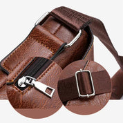 Borsa a tracolla in pelle marrone con cerniera robusta e fibbia regolabile. Design elegante, ideale per uomo e donna. Accessorio moda versatile.