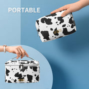 Astuccio cosmetico portatile con stampa mucca, design elegante, chiusura a zip, ideale per viaggi, organizzazione trucco, accessori moda.