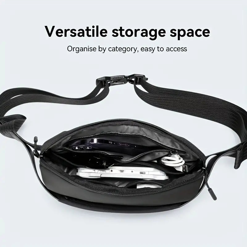 Marsupio nero con cerniera aperta, mostra spazio versatile per organizzare smartphone, cavi e accessori. Design pratico e compatto per viaggi.