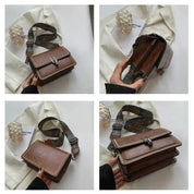 Borsa a tracolla in pelle marrone con fibbia metallica, tracolla regolabile decorata, design elegante e spazioso, ideale per moda donna.