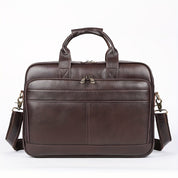 Borsa ventiquattrore in pelle marrone scuro con manici e tracolla regolabile, design elegante e spazioso, ideale per lavoro e viaggi d'affari.