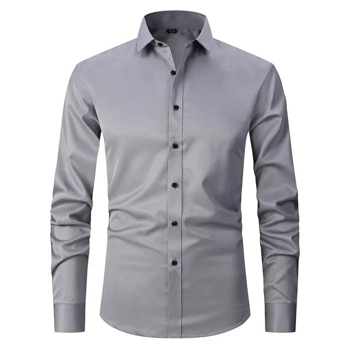 Camicia elegante da uomo grigia a maniche lunghe, bottoni neri, colletto classico. Ideale per ufficio e occasioni formali. Tessuto di qualità.