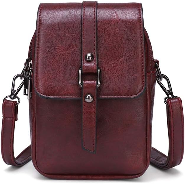 Borsa a tracolla in pelle marrone scuro, design elegante e compatto, con chiusura a fibbia e tracolla regolabile. Accessorio moda uomo/donna.