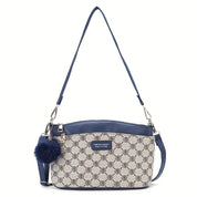 Borsa a tracolla donna in pelle blu e tessuto stampato, design elegante con ciondolo pompon, ideale per moda e accessori femminili.