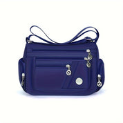 Borsa a tracolla blu in nylon con tasche multiple e cerniere, design elegante e funzionale, ideale per donna, accessorio moda versatile.