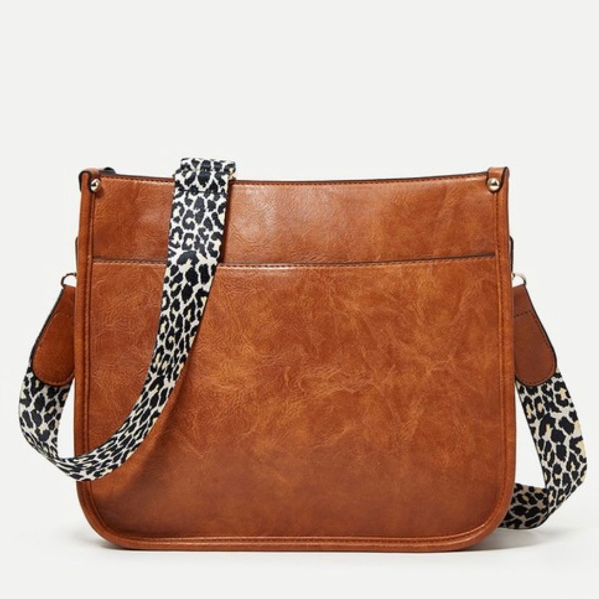 Borsa a tracolla in pelle marrone con cinturino leopardato, design elegante e moderno, perfetta per moda donna, accessorio versatile e chic.