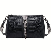 Borsa a tracolla in pelle nera effetto coccodrillo, dettagli in pelle di serpente, chiusura a fibbia, design elegante e moderno, accessorio moda donna.